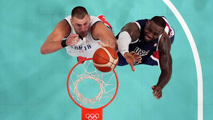  Serbia power forward Nikola Jokic and United States guard Lebron James jump for a rebound.