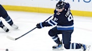 May 9, 2025; Winnipeg, Manitoba, CAN; Winnipeg Jets center Cole Perfetti (91) warms up before a game against the Dallas Stars in game two of the second round of the 2025 Stanley Cup Playoffs at Canada Life Centre. Mandatory Credit: James Carey Lauder-Imagn Images