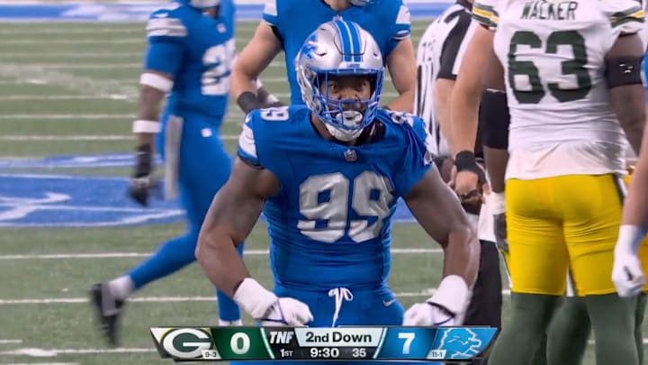 Detroit Lions defensive end Za'Darius Smith flexes after sacking Green Bay Packers quarterback Jordan Love. Detroit Lions defensive end Za'Darius Smith flexes after sacking Green Bay Packers quarterback Jordan Love.