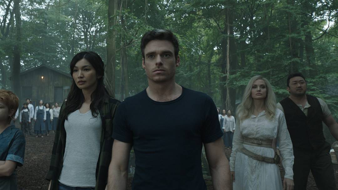 (L-R): Karun (Harish Patel), Kingo (Kumail Nanjiani), Sprite (Lia McHugh), Sersi (Gemma Chan), Ikaris (Richard Madden), Thena (Angelina Jolie), Gilgamesh (Don Lee) in Marvel Studios’ ETERNALS. Photo courtesy of Marvel Studios. ©Marvel Studios 2021. All Rights Reserved.