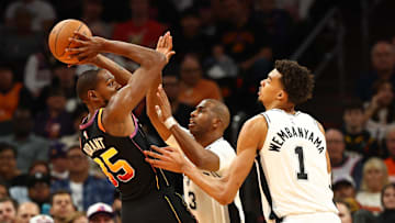 Dec 3, 2024; Phoenix, Arizona, USA; Phoenix Suns forward Kevin Durant (35) against San Antonio Spurs guard Chris Paul (3) and center Victor Wembanyama (1) in the first half of an NBA Cup game at Footprint Center. Mandatory Credit: Mark J. Rebilas-Imagn Images