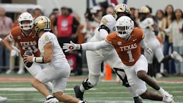 Nov 1, 2025; Austin, Texas, USA; Texas Longhorns defensive lineman Colin Simmons (1) reaches for Vanderbilt Commodores quarterback Diego Pavia (2) during the second half Darrell K Royal-Texas Memorial Stadium. Mandatory Credit: Scott Wachter-Imagn Images