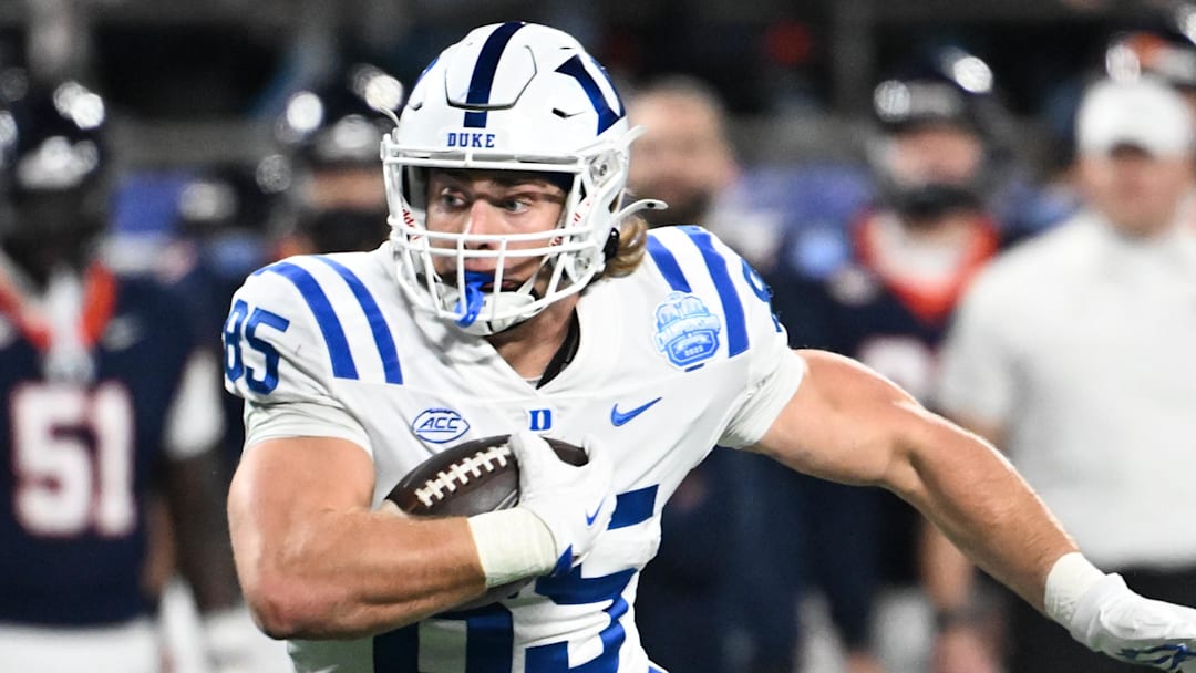 Dec 6, 2025; Charlotte, NC, USA; Duke Blue Devils tight end Jeremiah Hasley (85) runs the ball after a catch for a touchdown in the first quarter against the Virginia Cavaliers during the 2025 ACC Championship game at Bank of America Stadium. Mandatory Credit: Bob Donnan-Imagn Images