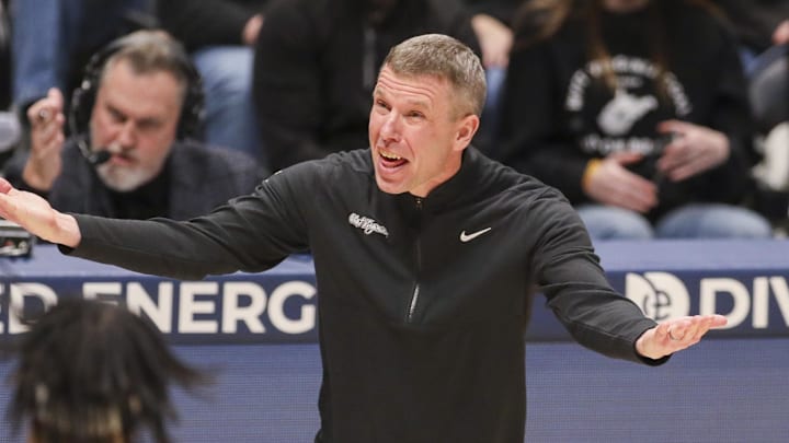 Feb 8, 2026; Morgantown, West Virginia, USA; West Virginia Mountaineers head coach Ross Hodge yells from the sideline during the first half against the Texas Tech Red Raiders at Hope Coliseum. Mandatory Credit: Ben Queen-Imagn Images