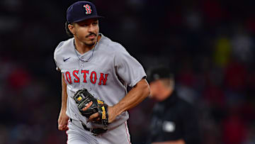Boston Red Sox second baseman David Hamilton (17) reacts after tagging out Los Angeles Angels shortstop Zach Neto (9) to end the eighth inning at Angel Stadium.