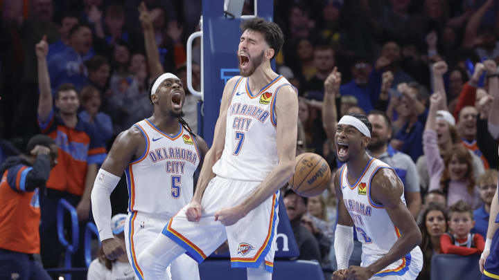 Dec 8, 2023; Oklahoma City, Oklahoma, USA; Oklahoma City Thunder forward Chet Holmgren (7), guard Luguentz Dort (5) and guard Shai Gilgeous-Alexander (2) celebrate after Chet Holmgren scores a basket against the Golden State Warriors during the second half at Paycom Center. Mandatory Credit: Alonzo Adams-USA TODAY Sports