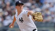 May 23, 2024; Bronx, New York, USA; New York Yankees relief pitcher Nick Burdi (57) pitches against the Seattle Mariners during the eighth inning at Yankee Stadium. Mandatory Credit: Brad Penner-Imagn Images