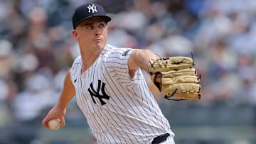 May 23, 2024; Bronx, New York, USA; New York Yankees relief pitcher Nick Burdi (57) pitches against the Seattle Mariners during the eighth inning at Yankee Stadium. Mandatory Credit: Brad Penner-Imagn Images