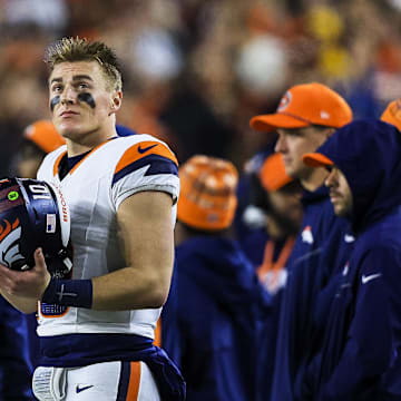 Dec 28, 2024; Cincinnati, Ohio, USA; Denver Broncos quarterback Bo Nix (10) stands on the sidelines during the second half against the Cincinnati Bengals at Paycor Stadium. Mandatory Credit: Katie Stratman-Imagn Images