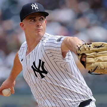 May 23, 2024; Bronx, New York, USA; New York Yankees relief pitcher Nick Burdi (57) pitches against the Seattle Mariners during the eighth inning at Yankee Stadium. Mandatory Credit: Brad Penner-Imagn Images