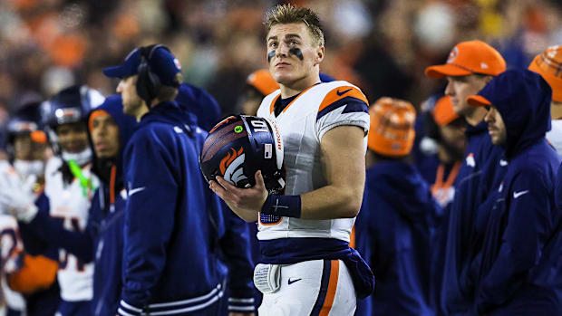 Dec 28, 2024; Cincinnati, Ohio, USA; Denver Broncos quarterback Bo Nix (10) stands on the sidelines during the second half ag