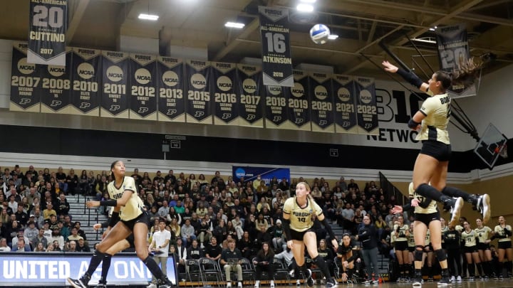 Purdue outside hitter Chloe Chicoine (2) hits the ball 