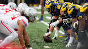 Michigan Wolverines offensive lineman Drake Nugent (60) prepares to snap the ball 