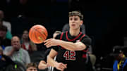 Mar 13, 2025; Charlotte, NC, USA; Stanford Cardinal forward Maxime Raynaud (42) passes the ball in the first half at Spectrum Center. Mandatory Credit: Bob Donnan-Imagn Images