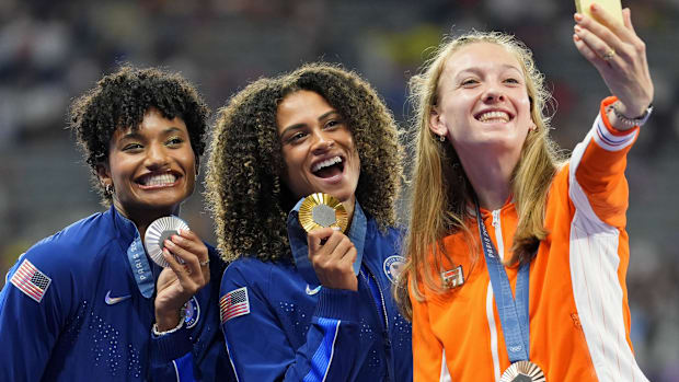 Aug 9, 2024; Paris Saint-Denis, France; Anna Cockrell (USA), Sydney McLaughlin-Levrone (USA), and Femke Bol (NED) celebrate t