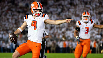 Illinois quarterback Luke Altmyer (9) points to one of his blockers as he runs with the ball in the second quarter of a Big Ten football game against Penn State, Saturday, Sept. 28, 2024, in State College, Pa.