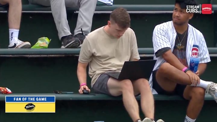This fan using his computer at Wrigley Field even brought a mouse. This fan using his computer at Wrigley Field even brought a mouse.