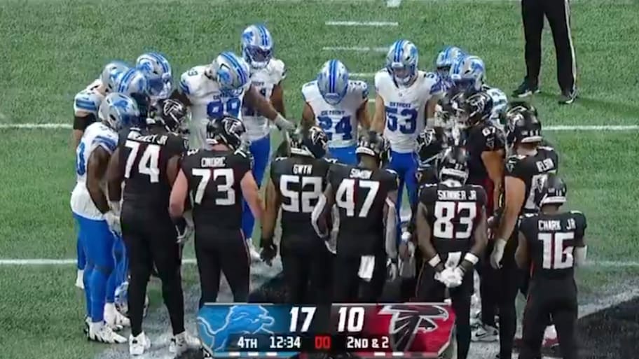 Lions and Falcons players held hands in a circle after Morice Norris was taken off the field in an ambulance. | Crunch Time Sports/Screengrab