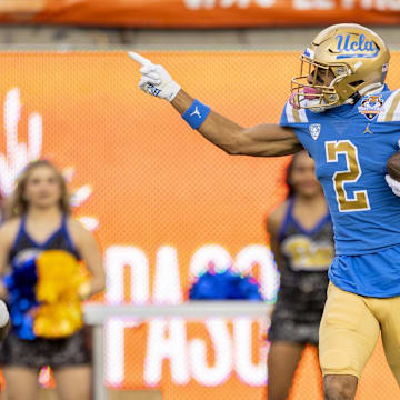 Dec 30, 2022; El Paso, Texas, USA; UCLA Bruins wide receiver Titus Mokiao-Atimalala (2) celebrates after making a catch against the Pittsburgh Panthers defense in the first half in the 2022 Sun Bowl at Sun Bowl. Mandatory Credit: Ivan Pierre Aguirre-Imagn Images