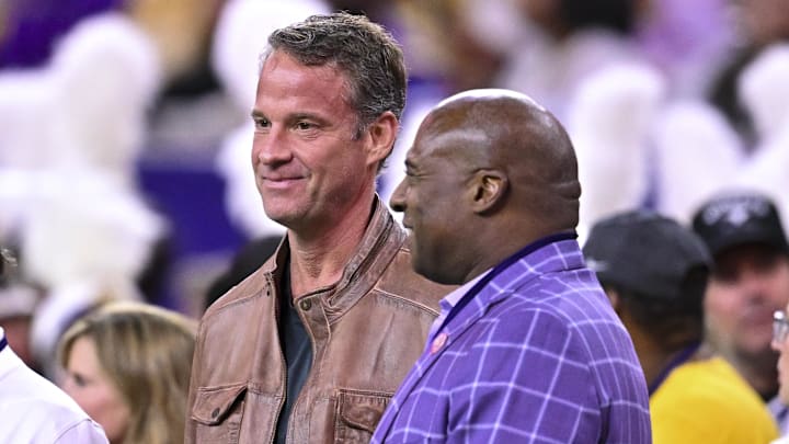 Dec 27, 2025; Houston, TX, USA; Louisiana State Tigers head coach Lane Kiffin, left, stands next to Louisiana State Tigers athletic director Verge Ausberry, right, prior to the game against the Houston Cougars at NRG Stadium. Mandatory Credit: Maria Lysaker-Imagn Images 