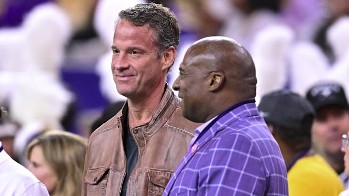 Dec 27, 2025; Houston, TX, USA; Louisiana State Tigers head coach Lane Kiffin, left, stands next to Louisiana State Tigers athletic director Verge Ausberry, right, prior to the game against the Houston Cougars at NRG Stadium. Mandatory Credit: Maria Lysaker-Imagn Images 