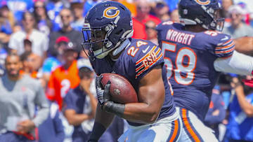 Former Chicago Bears running back Khalil Herbert (24) runs with the ball against the Buffalo Bills during the first half at Highmark Stadium.