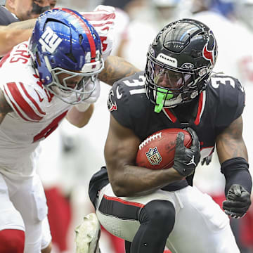 Aug 17, 2024; Houston, Texas, USA; Houston Texans running back Dameon Pierce (31) runs with the ball on a play during the second quarter against the New York Giants at NRG Stadium. Mandatory Credit: Troy Taormina-Imagn Images