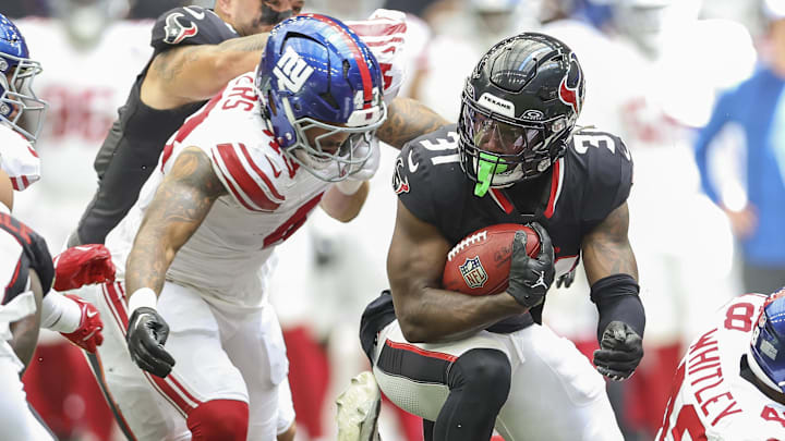 Aug 17, 2024; Houston, Texas, USA; Houston Texans running back Dameon Pierce (31) runs with the ball on a play during the second quarter against the New York Giants at NRG Stadium. Mandatory Credit: Troy Taormina-Imagn Images