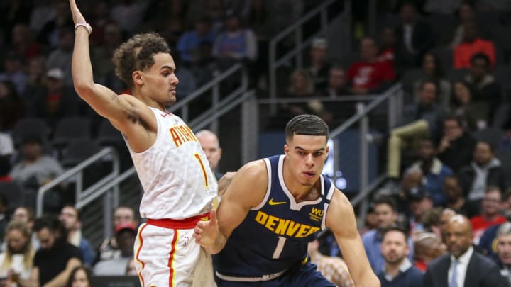 Jan 6, 2020; Atlanta, Georgia, USA; Denver Nuggets forward Michael Porter Jr. (1) drives on Atlanta Hawks guard Trae Young (11) in the first half at State Farm Arena. 