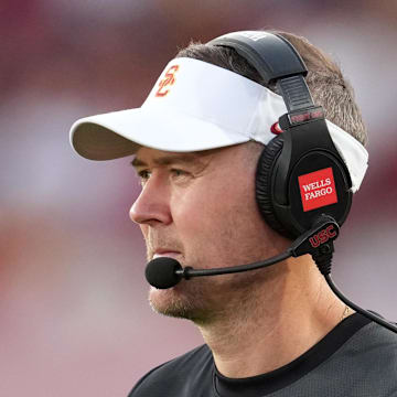 Aug 30, 2025; Los Angeles, California, USA; Southern California Trojans head coach Lincoln Riley watches from the sidelines against the Missouri State Bears in the first half at United Airlines Field at Los Angeles Memorial Coliseum. Mandatory Credit: Kirby Lee-Imagn Images