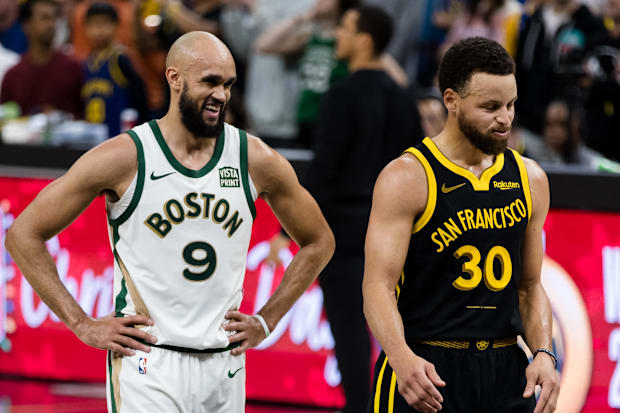 Boston Celtics guard Derrick White (9) and Golden State Warriors guard Stephen Curry