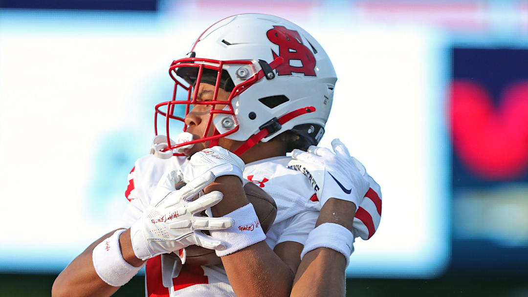 Severn Spalding wide receiver Myles Mcafee, top, catches a touchdown pass over Hoban cornerback Elbert ÒRockÓ Hill IV during the first half of a high school football game, Friday, Aug. 23, 2024, in Akron, Ohio.