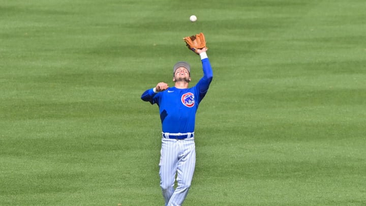 Mar 2, 2023; Mesa, Arizona, USA; Chicago Cubs shortstop Nico Hoerner (2) catches a fly ball in the
