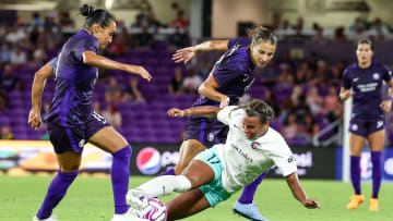 Jun 24, 2023; Orlando, Florida, USA; Kansas City Current forward Michelle Cooper (17) attempts controls the ball as Orlando Pride defender Kylie Strom (3) and forward Marta (10) defend at Exploria Stadium. Mandatory Credit: Nathan Ray Seebeck-USA TODAY Sports