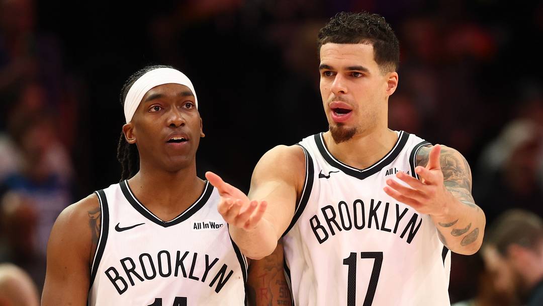 Jan 27, 2026; Phoenix, Arizona, USA; Brooklyn Nets forward Michael Porter Jr. (17) and guard Terance Mann (14) against the Phoenix Suns at Mortgage Matchup Center. Mandatory Credit: Mark J. Rebilas-Imagn Images