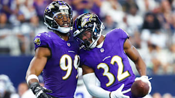 Sep 22, 2024; Arlington, Texas, USA;  Baltimore Ravens safety Marcus Williams (32) celebrates with Baltimore Ravens linebacker Odafe Oweh (99) after recovering a fumble during the first half at AT&T Stadium. 
