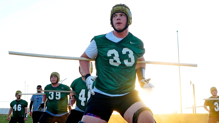 Basha offensive tackle Jake Hildebrand runs a drill during a practice at Basha High School on April 25, 2024. Basha offensive tackle Jake Hildebrand runs a drill during a practice at Basha High School on April 25, 2024.