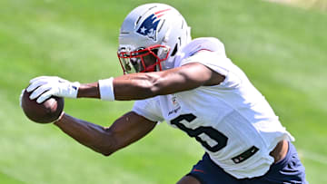 New England Patriots wide receiver Javon Baker (6) makes a catch during training camp at Gillette Stadium.
