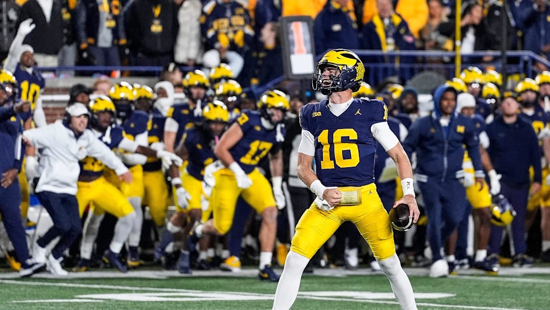 Michigan quarterback Davis Warren (16) celebrates as time expires in the 24-17 win over Michigan State at Michigan Stadium in Ann Arbor on Saturday, Oct. 26, 2024.