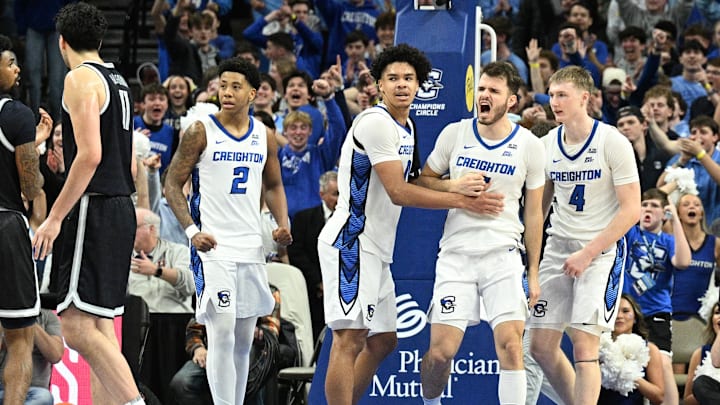 Jan 13, 2026; Omaha, Nebraska, USA;  Creighton Bluejays guard Fedor Žugic (7) reacts with guard Blake Harper (2), forward Jasen Green (0) and guard Josh Dix (4) after a turnover against the Georgetown Hoyas during the overtime period at CHI Health Center Omaha. Mandatory Credit: Steven Branscombe-Imagn Images
