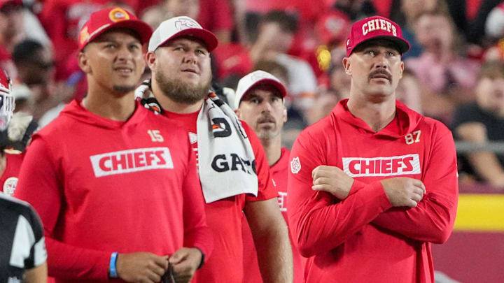 Aug 22, 2024; Kansas City, Missouri, USA; Kansas City Chiefs tight end Travis Kelce (87), quarterback Patrick Mahomes (15) and center Creed Humphrey (52) react to play on the sidelines against the Chicago Bears during the game at GEHA Field at Arrowhead Stadium. Mandatory Credit: Denny Medley-Imagn Images Aug 22, 2024; Kansas City, Missouri, USA; Kansas City Chiefs tight end Travis Kelce (87), quarterback Patrick Mahomes (15) and center Creed Humphrey (52) react to play on the sidelines against the Chicago Bears during the game at GEHA Field at Arrowhead Stadium. Mandatory Credit: Denny Medley-Imagn Images