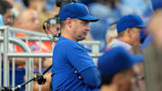 Sep 28, 2025; Miami, Florida, USA; New York Mets manager Carlos Mendoza (64) watches from the dugout against the Miami Marlins during the eighth inning at loanDepot Park. Mandatory Credit: Sam Navarro-Imagn Images