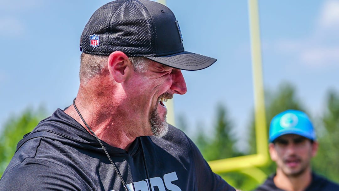 Detroit Lions head coach Dan Campbell jokes around with former Detroit Lions RB and Hall of Fame inductee Barry Sanders during the joint practice with the Miami Dolphins at the Lions headquarters and training facility in Allen Park, Thursday, Aug. 14, 2025