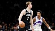 Dec 4, 2025; Brooklyn, New York, USA; Brooklyn Nets forward Danny Wolf (2) dribbles the ball against Utah Jazz forward Brice Sensabaugh (28) during the fourth quarter at Barclays Center. Mandatory Credit: Tom Horak-Imagn Images