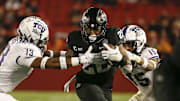 Iowa State junior running back Breece Hall busts through the defense of TCU linebacker Dee Winters, left, and safety Josh Foster en route to one of his four total touchdowns on Friday, Nov. 26, 2021, at Jack Trice Stadium in Ames.

20211126 Iowastatevstcu