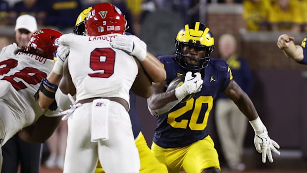 Aug 31, 2024; Ann Arbor, Michigan, USA;  Michigan Wolverines running back Kalel Mullings (20) runs the ball against the Fresn