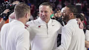 Jan 7, 2025; Athens, Georgia, USA; Georgia Bulldogs head coach Mike White reacts with members of his staff after Georgia defeated the Kentucky Wildcats at Stegeman Coliseum. Mandatory Credit: Dale Zanine-Imagn Images