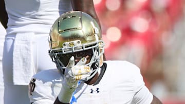 Sep 27, 2025; Fayetteville, Arkansas, USA; Notre Dame Fighting Irish running back Jeremiyah Love (4) signals first down after a run in the first quarter against the Arkansas Razorbacks at Donald W. Reynolds Razorback Stadium. Mandatory Credit: Nelson Chenault-Imagn Images