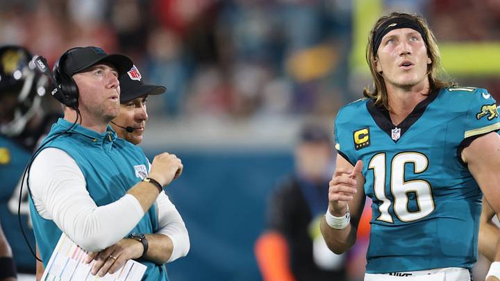 Oct 6, 2025; Jacksonville, Florida, USA; Jacksonville Jaguars head coach Liam Coen and quarterback Trevor Lawrence (16) during the first half against the Kansas City Chiefs at EverBank Stadium. 