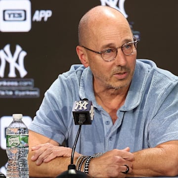 Aug 23, 2023; Bronx, New York, USA; New York Yankees general manager Brian Cashman talks with the media before the game between the Yankees and the Washington Nationals at Yankee Stadium. Mandatory Credit: Vincent Carchietta-Imagn Images